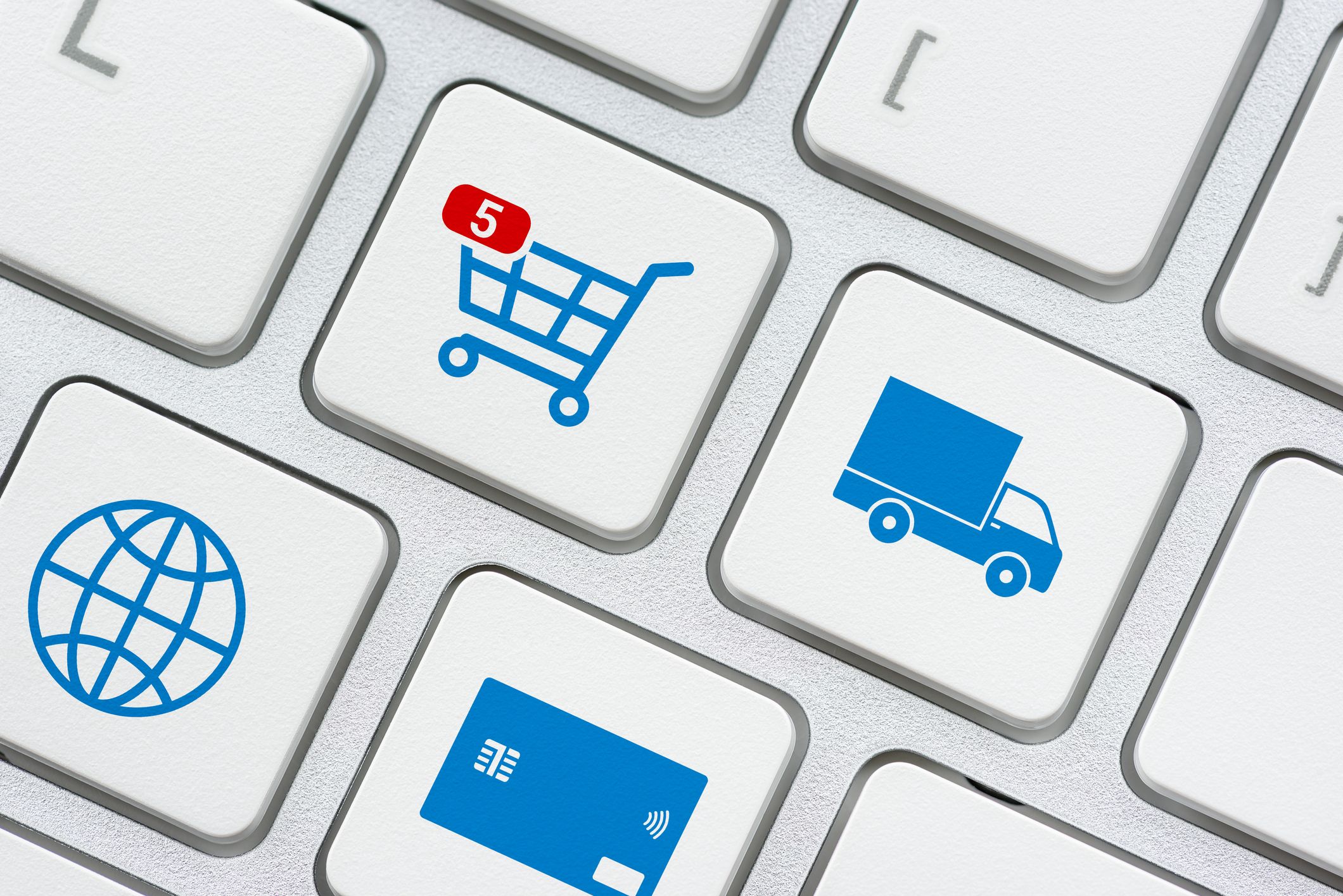 Online shopping / ecommerce and retail sale concept : Shopping cart, delivery van, credit card, world globe logo on a laptop keyboard, depicts customers order things from retailer sites using internet Why the time is now for behavioural pricing