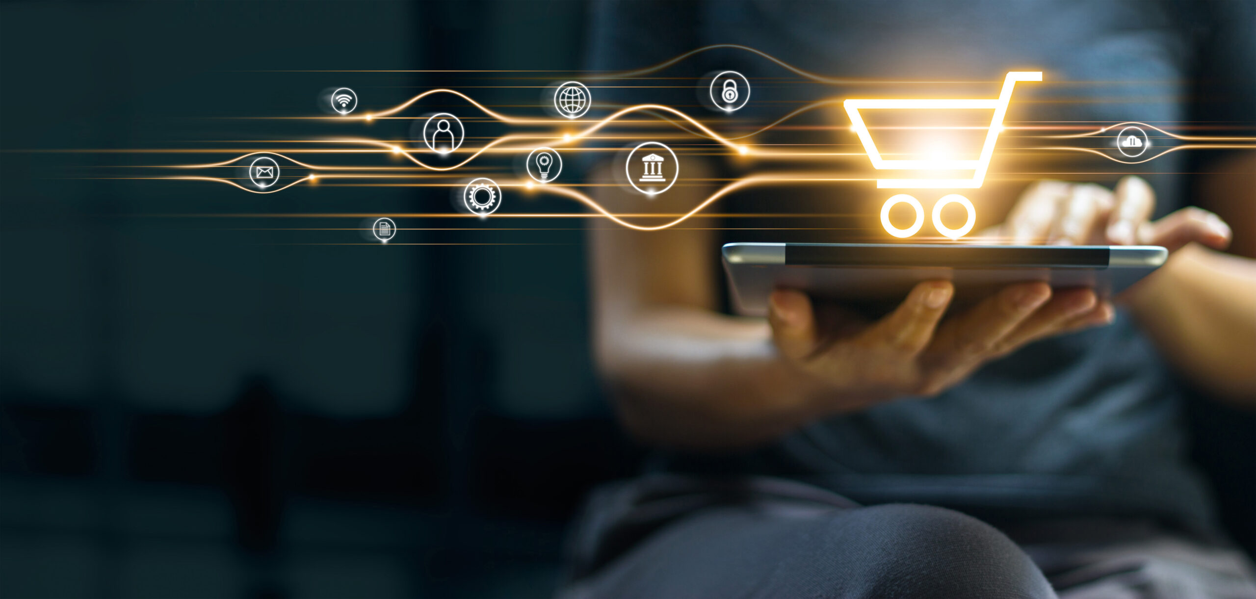 Online shopping and payment, Man using tablet with shopping cart icon, Digital marketing, Banking and finance on dark blue background. Retailers: it’s time to enter the Unified Commerce era